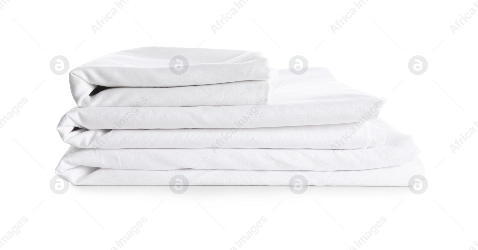 Photo of Stack of clean bed linen isolated on white