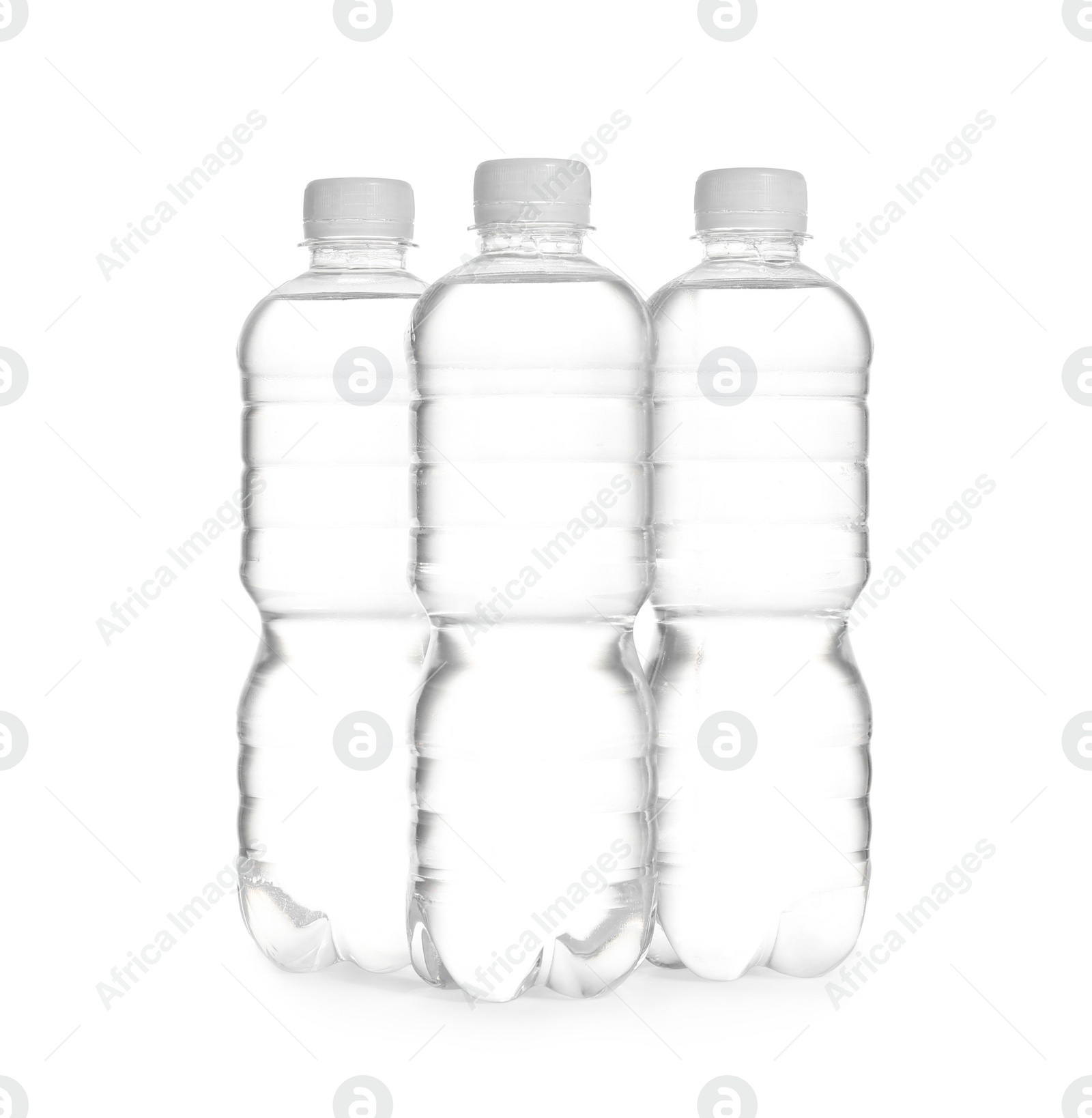 Photo of Plastic bottles with pure water on white background