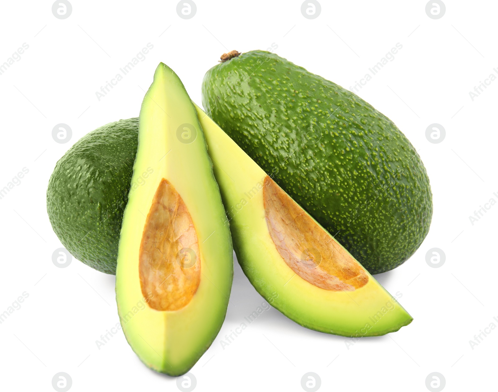 Photo of Tasty ripe avocados on white background. Tropical fruit