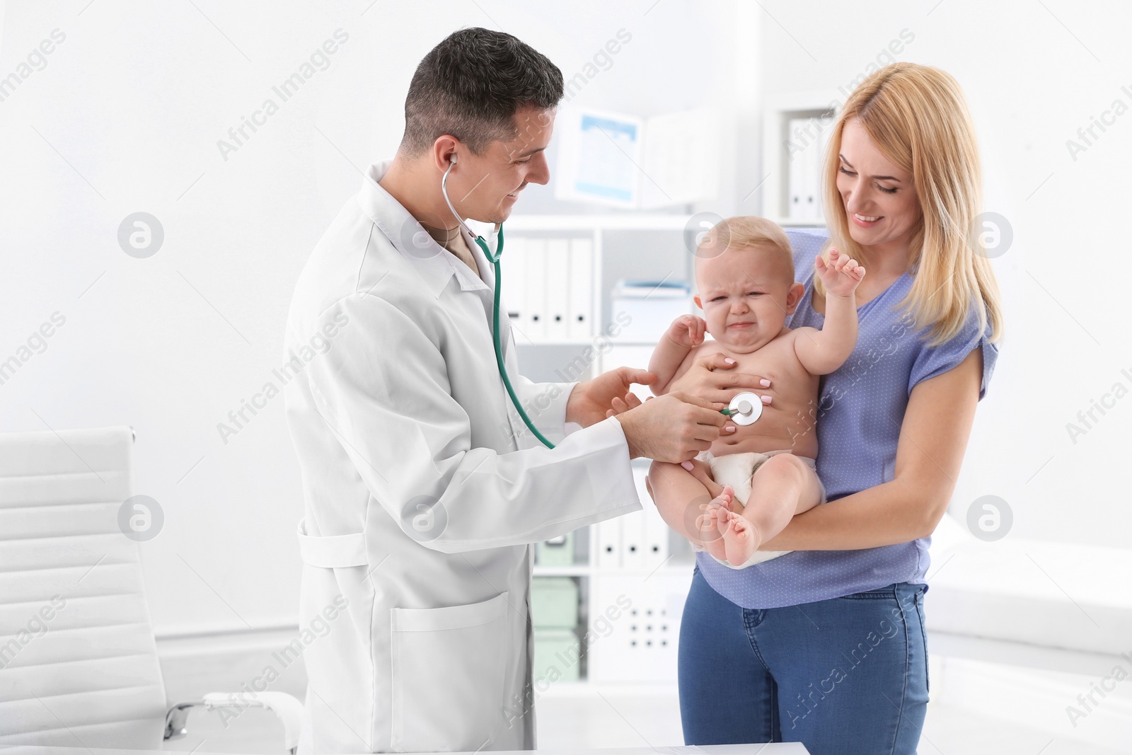 Photo of Woman with her baby visiting children's doctor in hospital