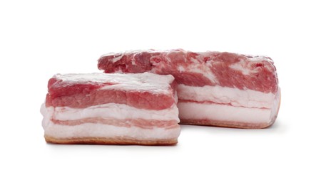 Pieces of pork fatback on white background