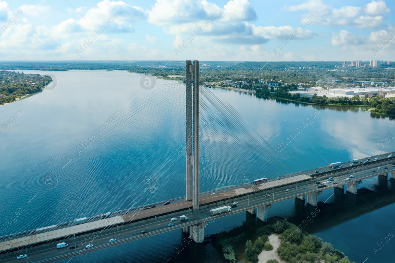 Image of Aerial view of modern bridge over river