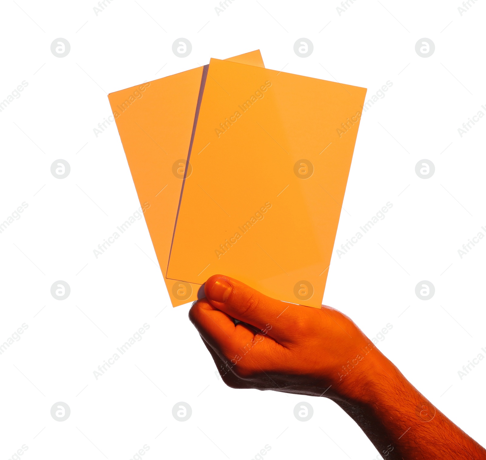 Photo of Man holding orange flyers on white background, closeup. Mockup for design