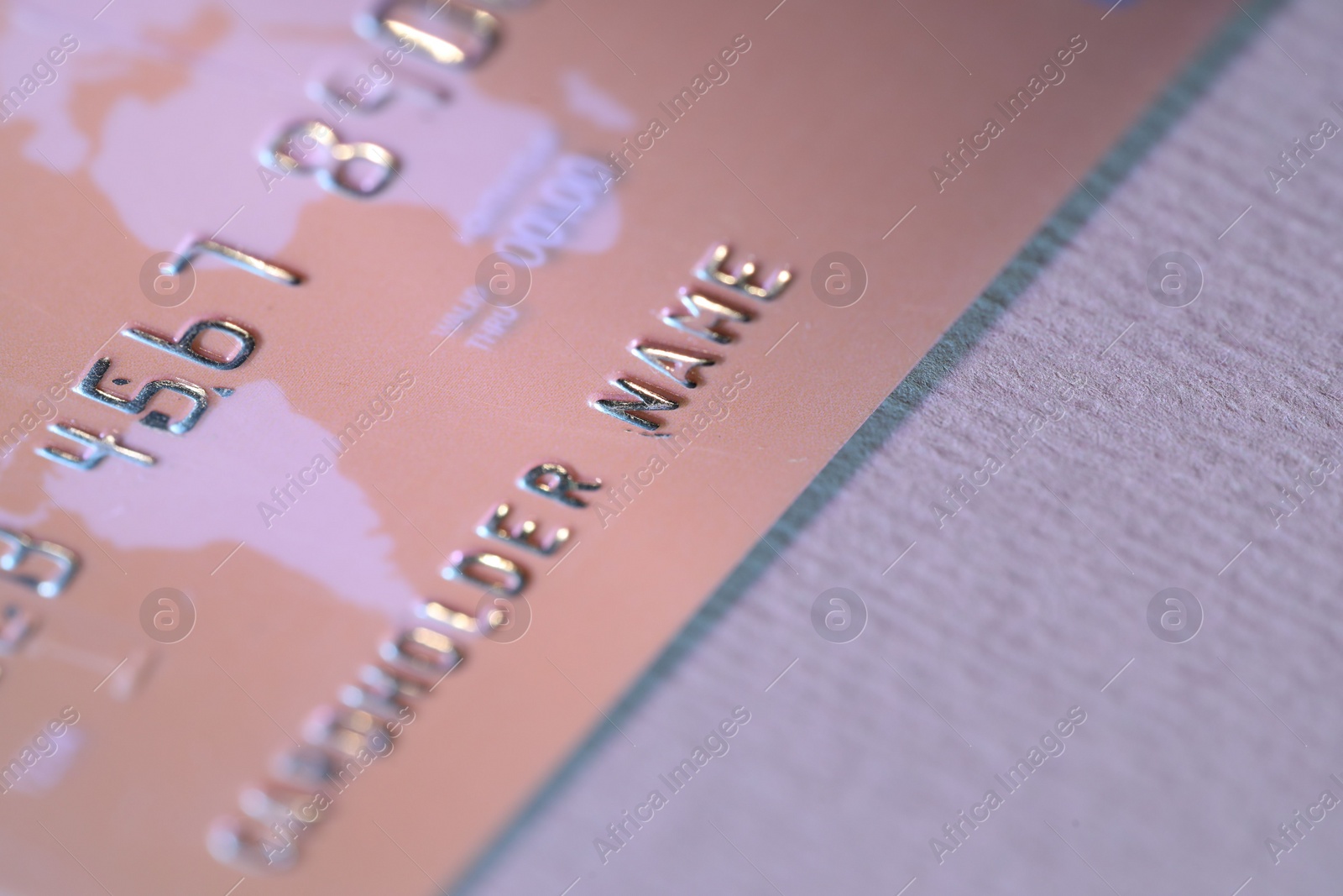 Photo of One credit card on light background, closeup