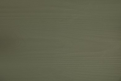 Photo of Texture of dark green wooden surface as background, top view