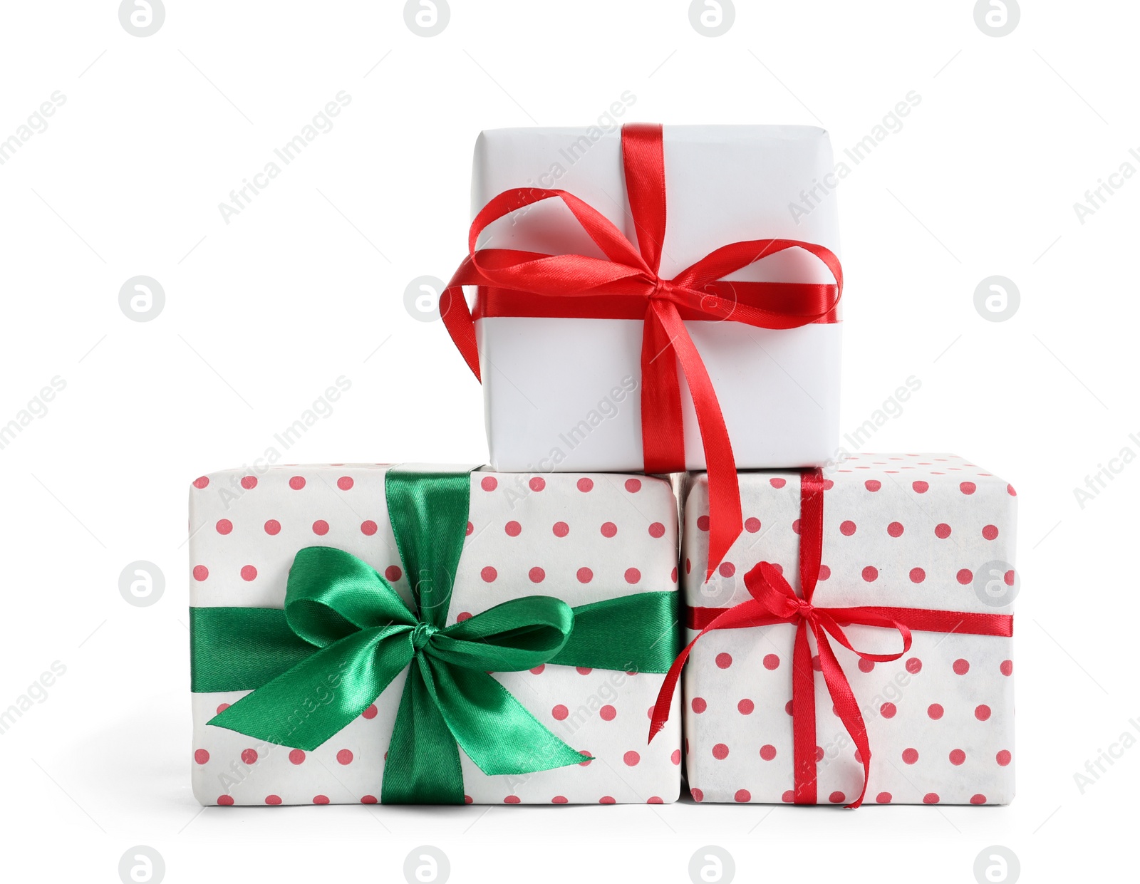 Photo of Beautifully wrapped gift boxes on white background