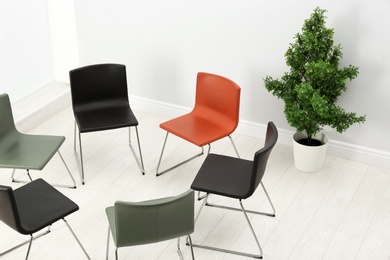 Chairs prepared for group therapy session in office. Meeting room interior