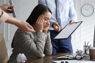 Photo of Businesswoman stressing out at workplace in office