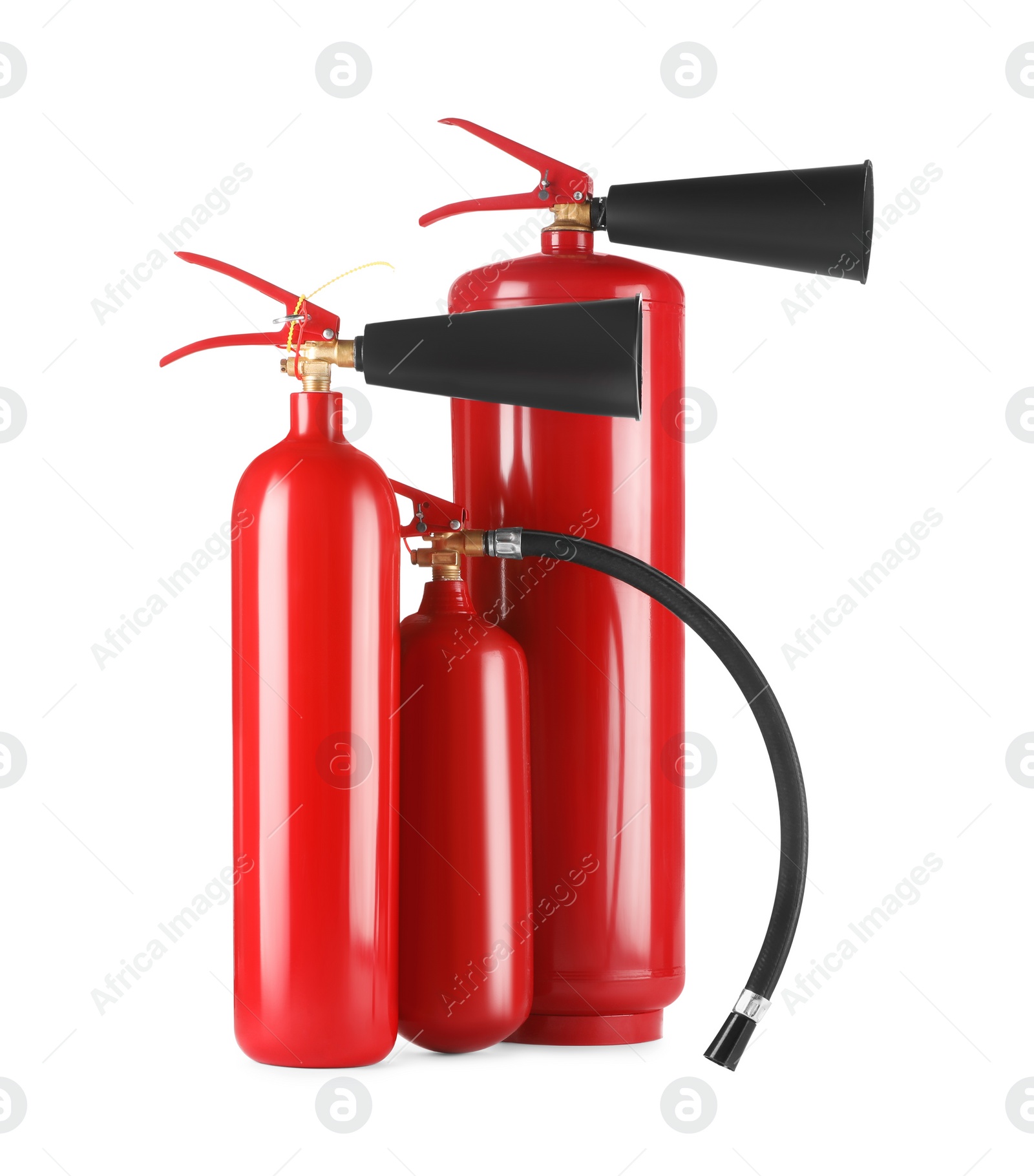 Photo of Three red fire extinguishers on white background