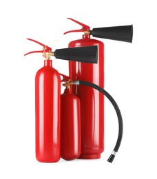 Photo of Three red fire extinguishers on white background