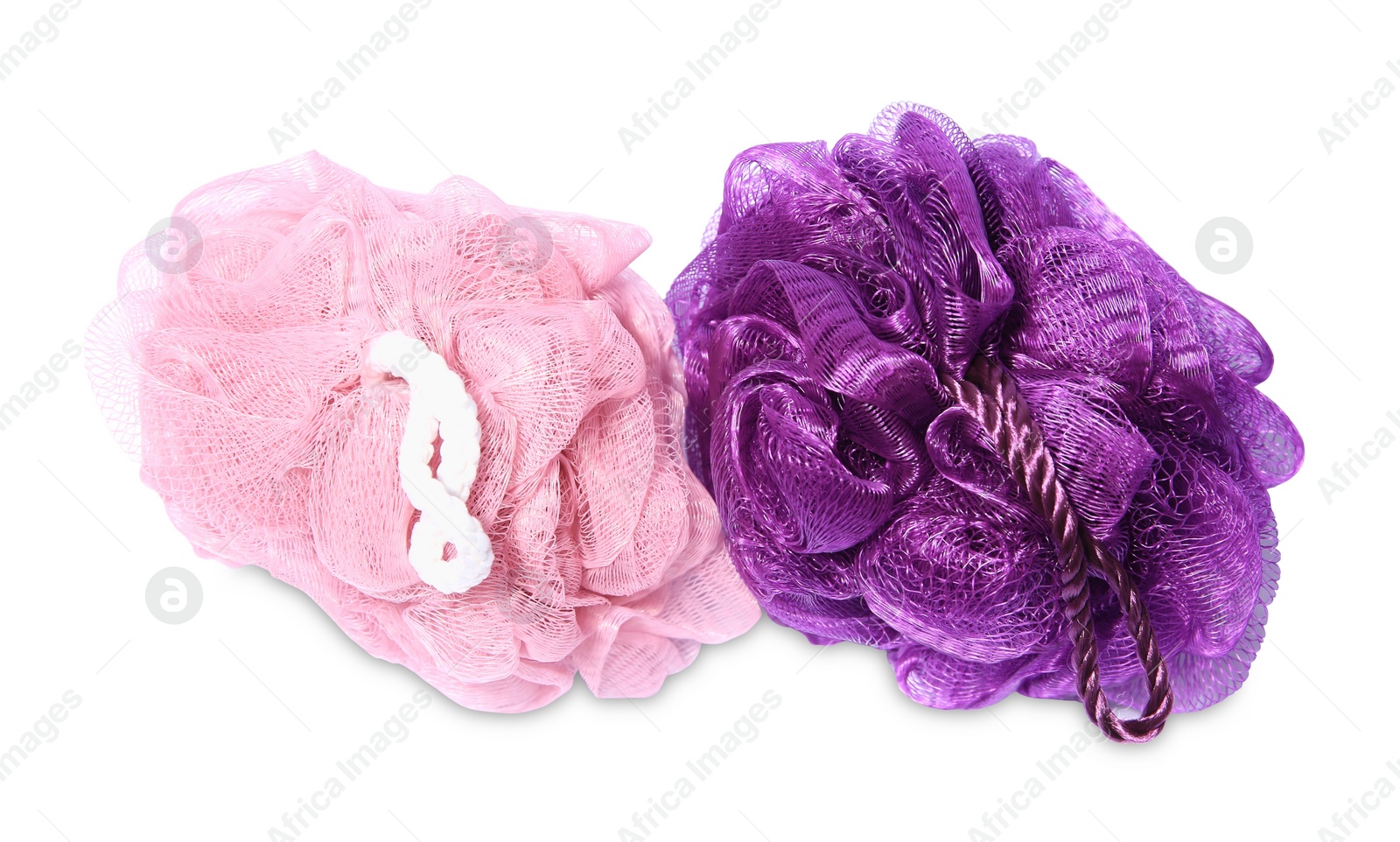 Photo of New shower puffs on white background, top view. Personal hygiene