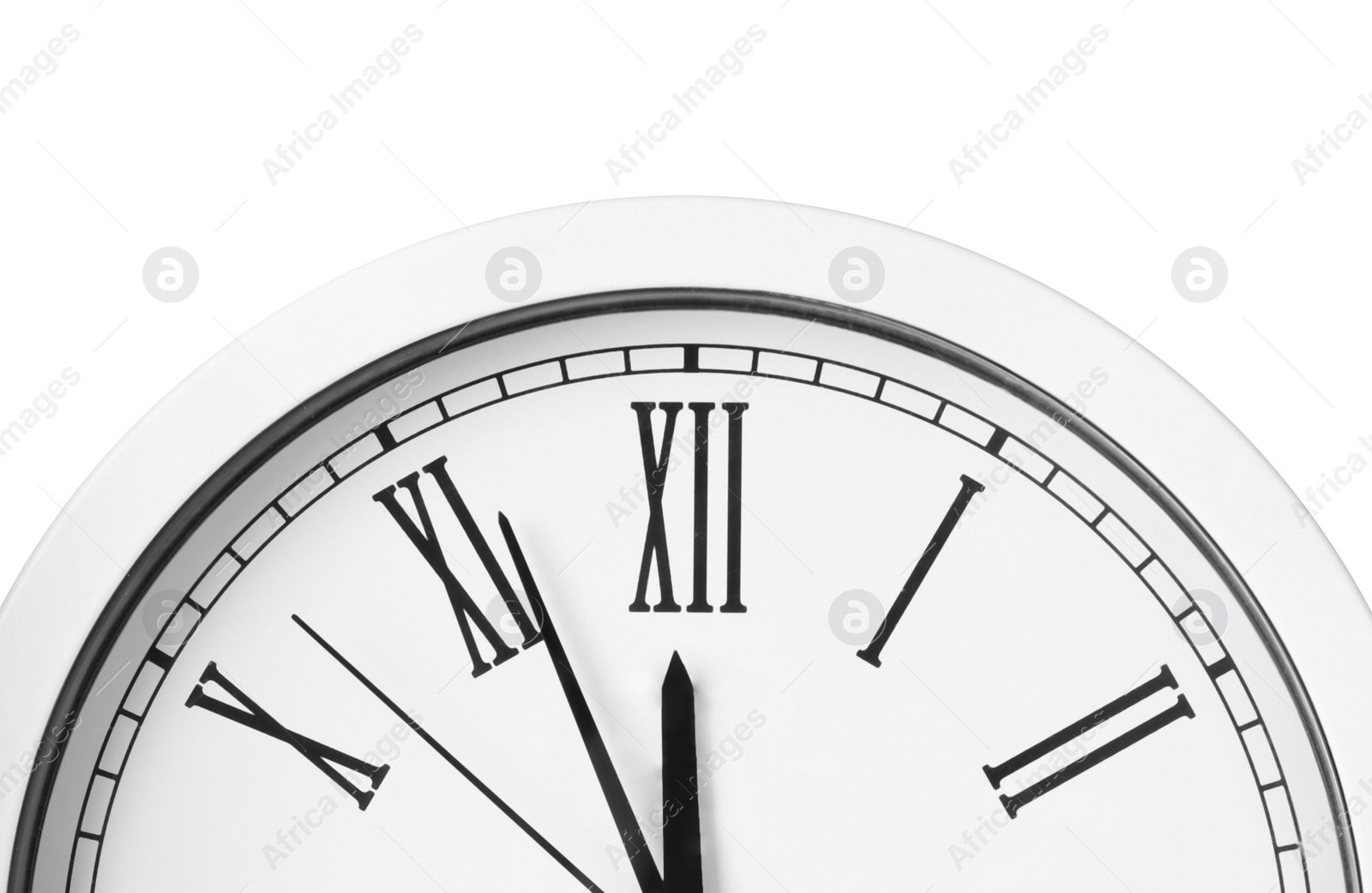 Photo of Clock showing five minutes until midnight on white background, closeup. New Year countdown