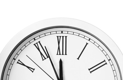 Photo of Clock showing five minutes until midnight on white background, closeup. New Year countdown