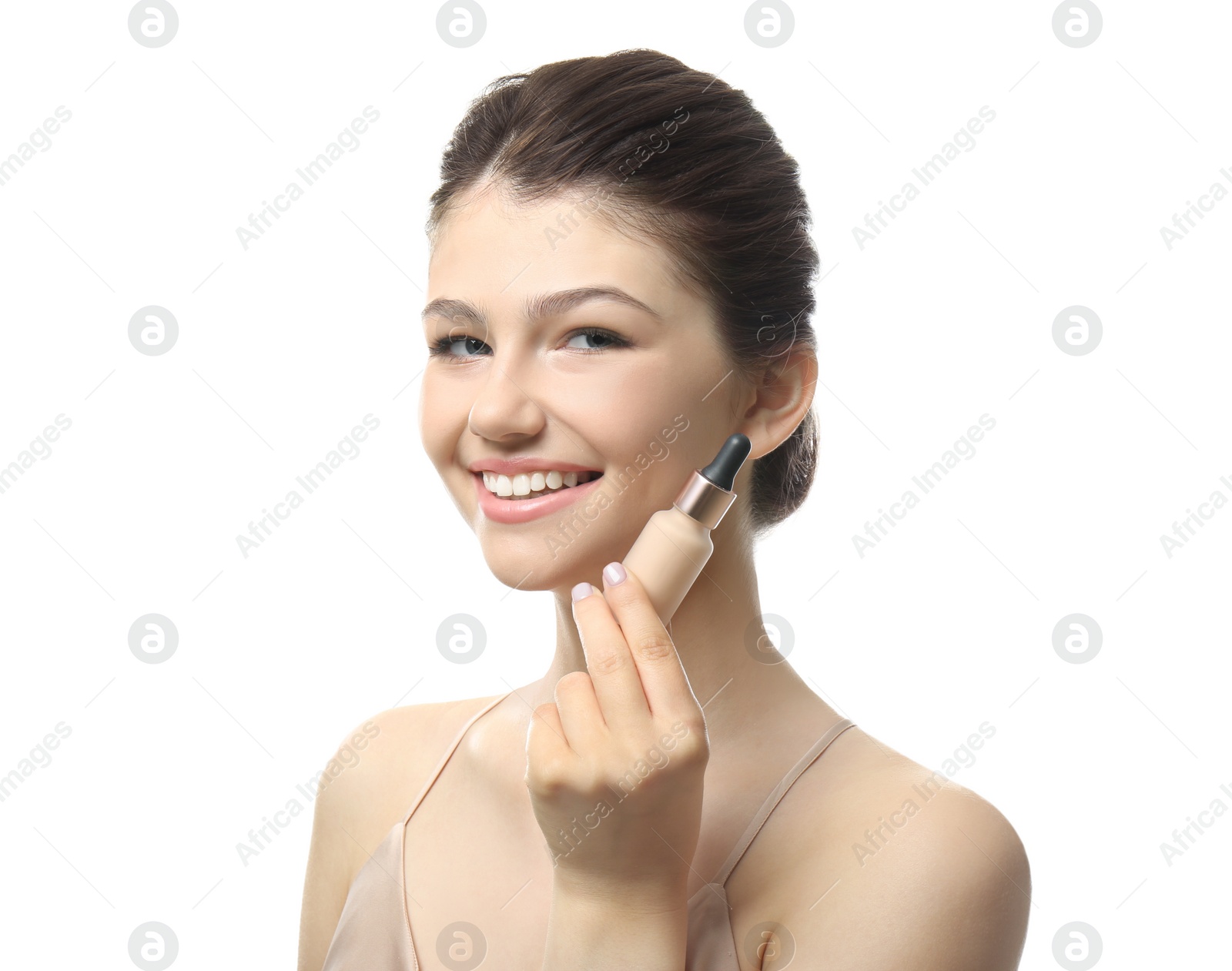 Photo of Beautiful girl with bottle of foundation on white background