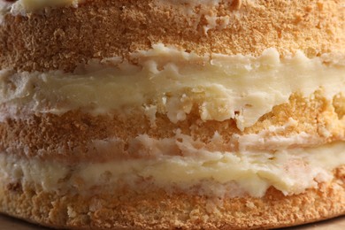Photo of Tasty cake with cream as background, closeup