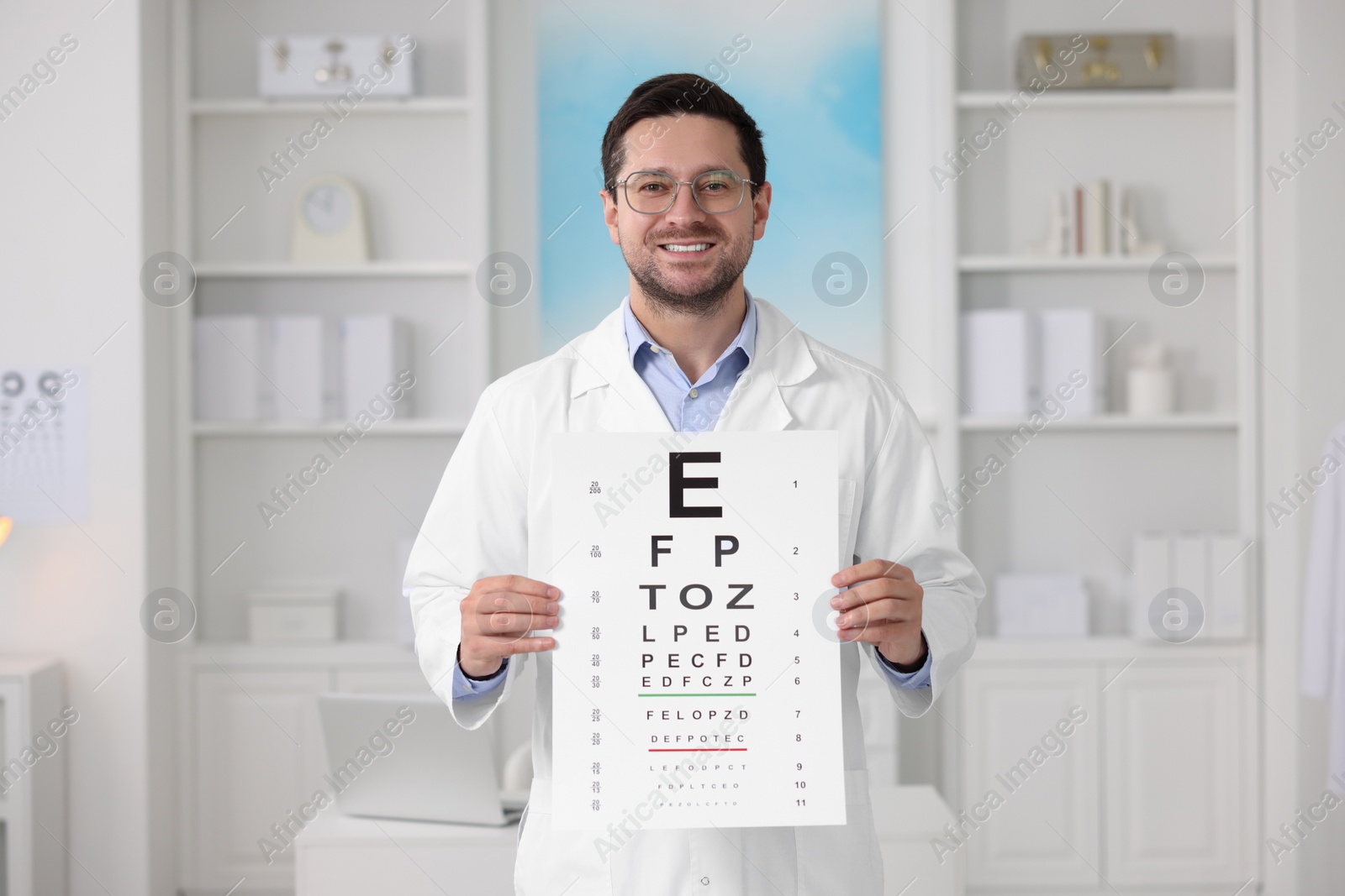 Photo of Ophthalmologist with vision test chart in clinic