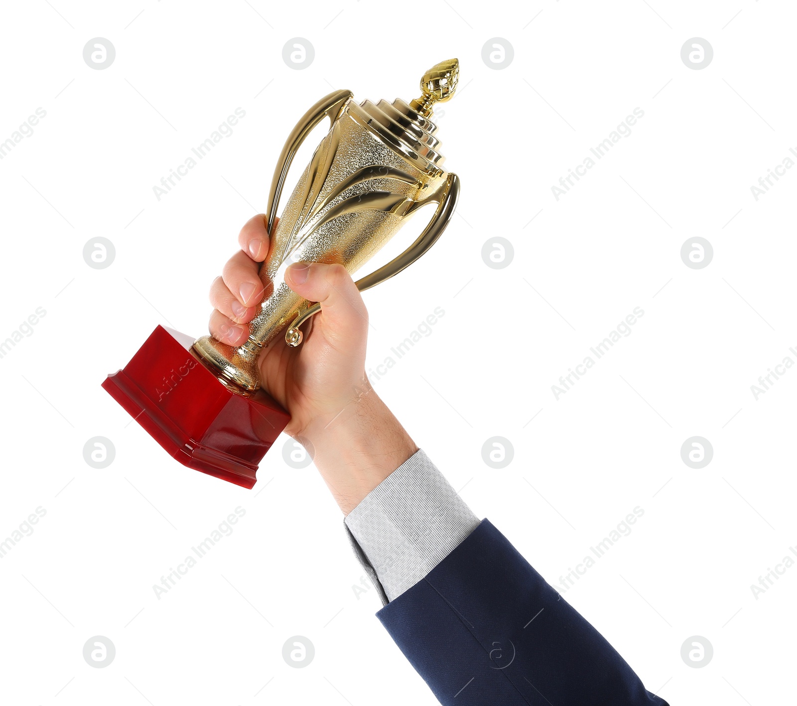 Photo of Businessman holding gold trophy cup on white background, closeup