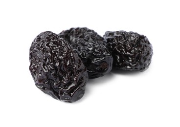 Photo of Sweet dried prunes on white background. Healthy snack