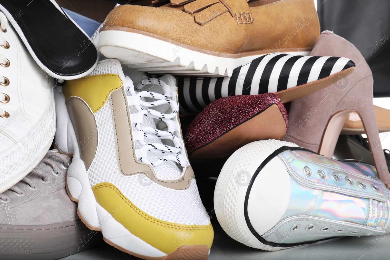 Photo of Different colorful female shoes as background, closeup