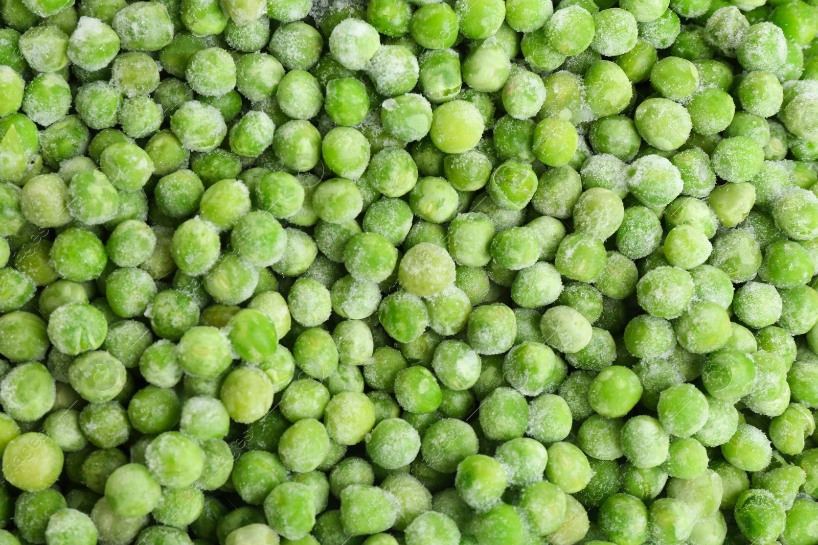 Photo of Tasty frozen peas as background, top view. Vegetable preservation