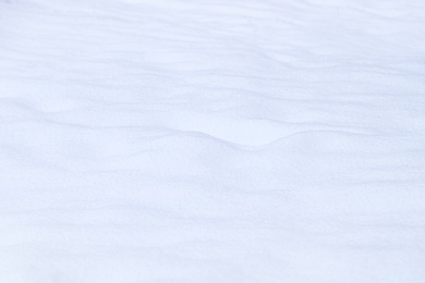 Photo of Beautiful shiny snow as background, closeup view