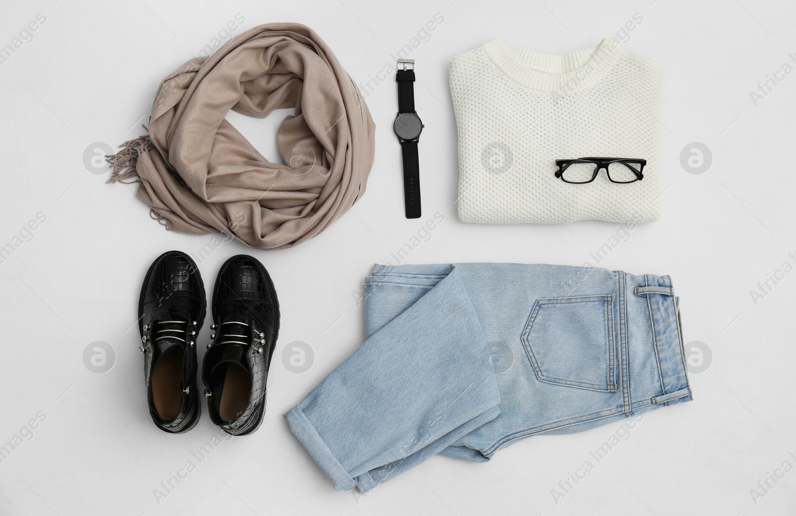 Photo of Set with ankle boots, stylish clothes and accessories on white background, top view