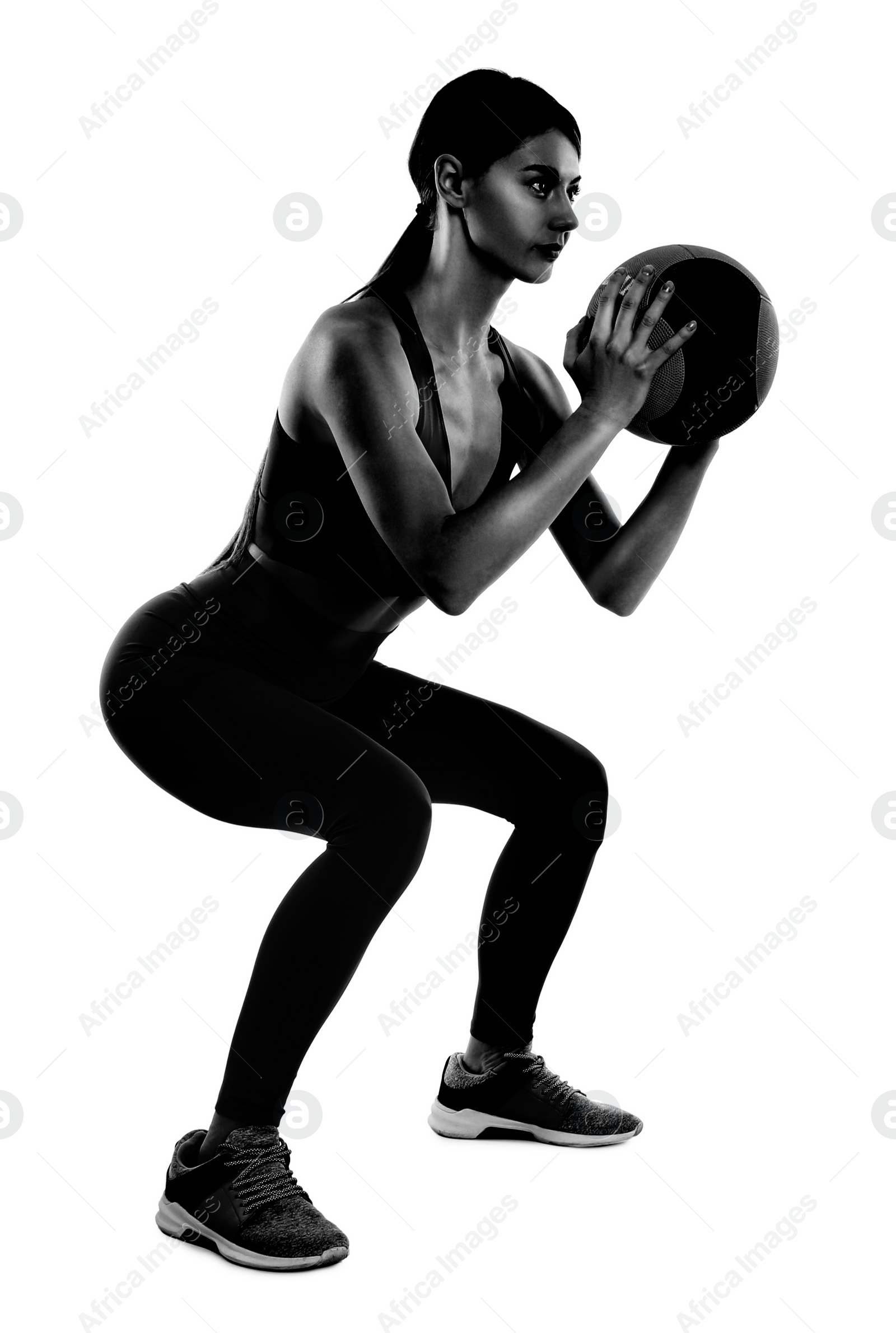 Image of Athletic woman with medicine ball isolated on white