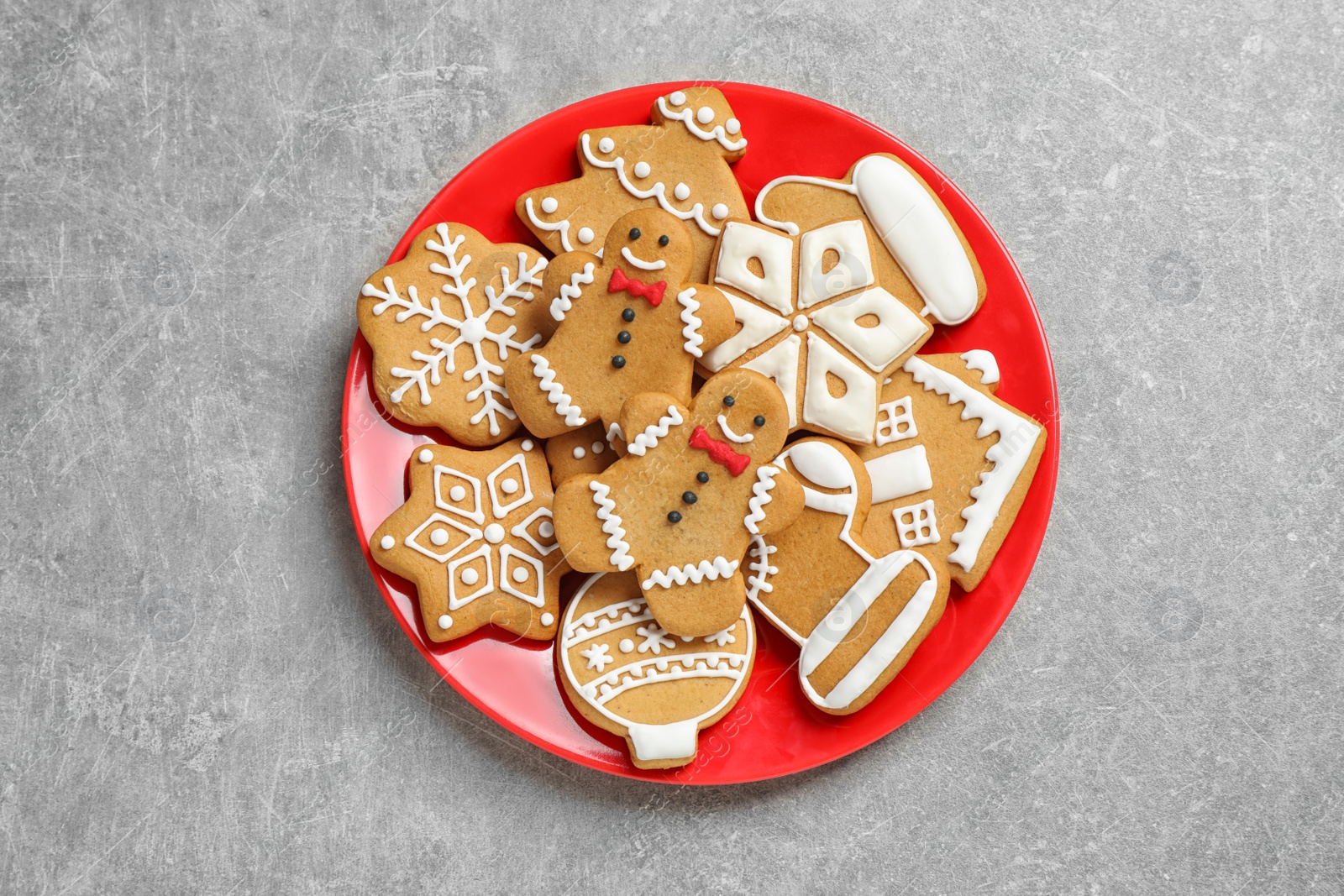 Photo of Tasty homemade Christmas cookies on grey table, top view