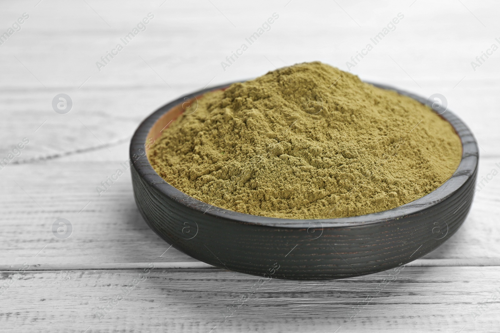 Photo of Hemp protein powder in dishware on table. Superfood