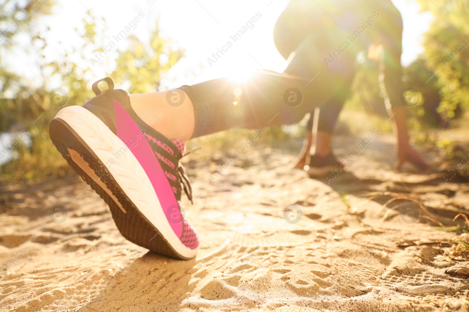 Photo of Young woman ready for running in countryside on sunny day