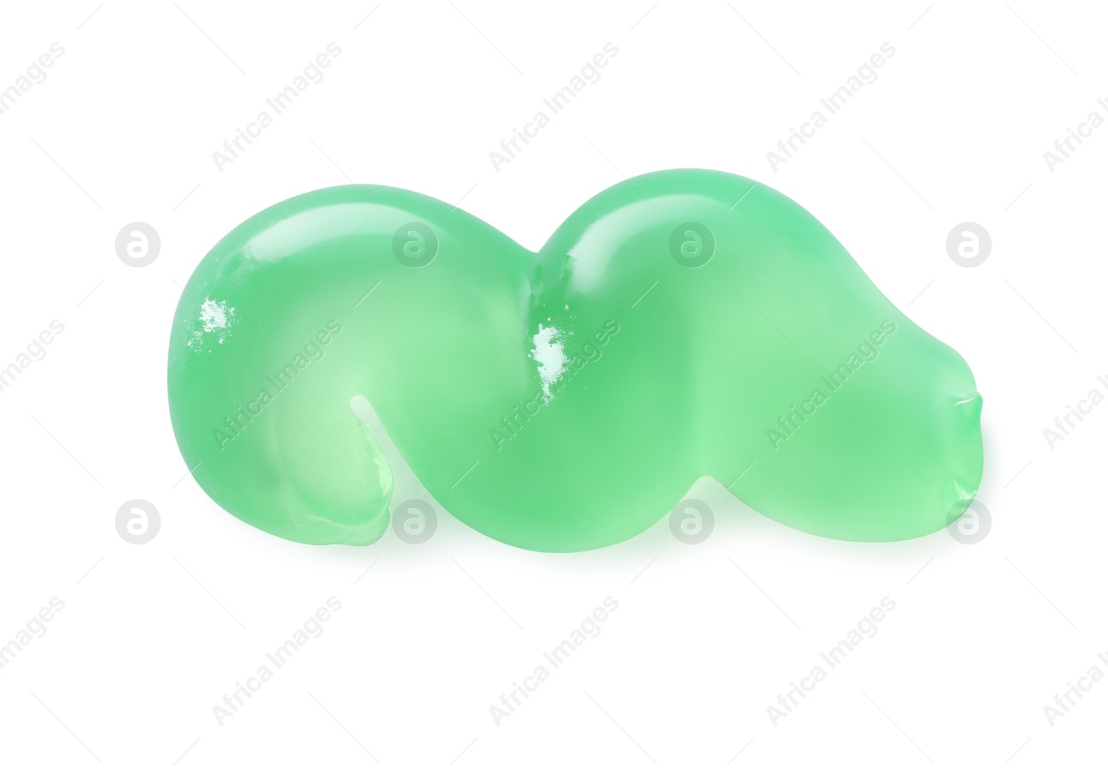 Photo of Smear of green toothpaste isolated on white