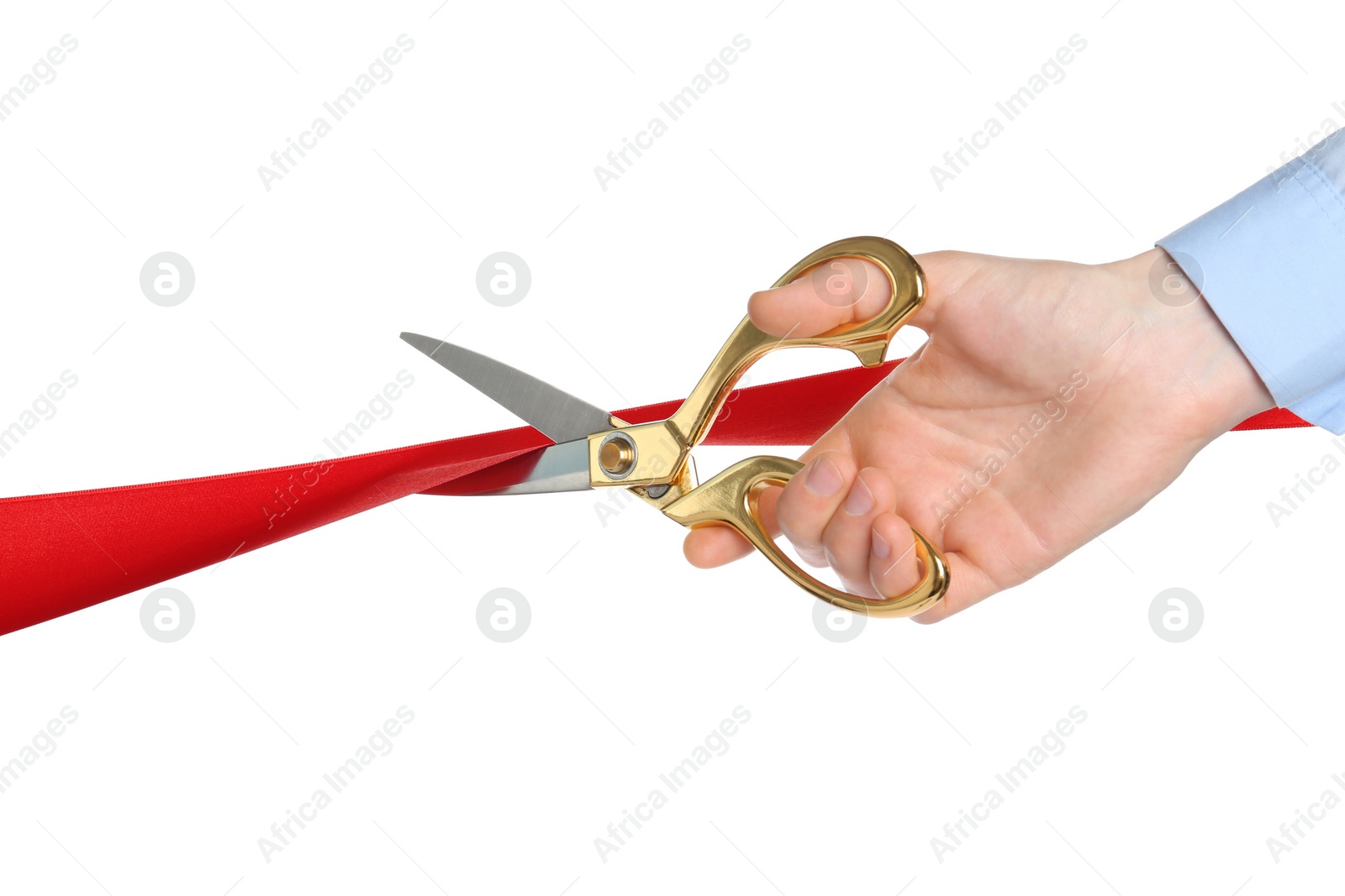Photo of Man cutting red ribbon on white background, closeup
