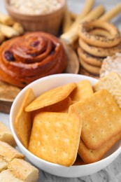 Photo of Different gluten free products on light grey textured table, closeup