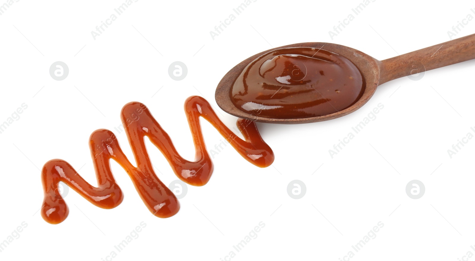 Photo of Tasty barbecue sauce and spoon isolated on white