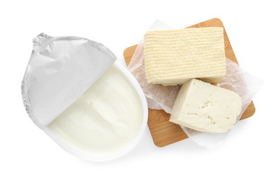 Photo of Tasty tofu and cream cheese on white background, top view