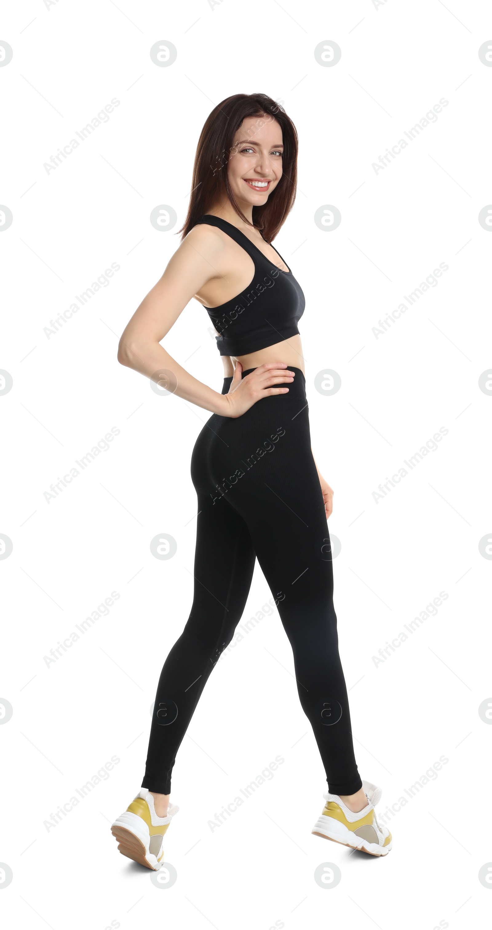 Photo of Happy young woman with slim body posing on white background