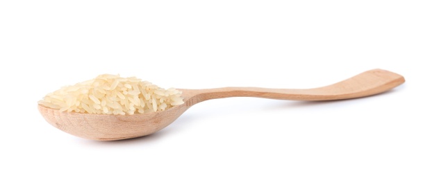 Photo of Spoon with uncooked parboiled rice on white background