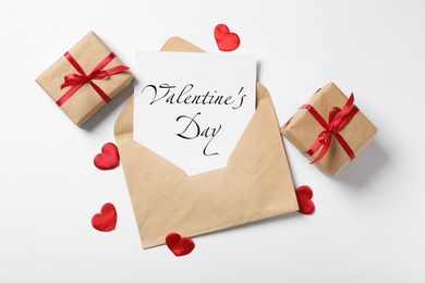 Image of Happy Valentine's Day. Flat lay composition with greeting card on white background