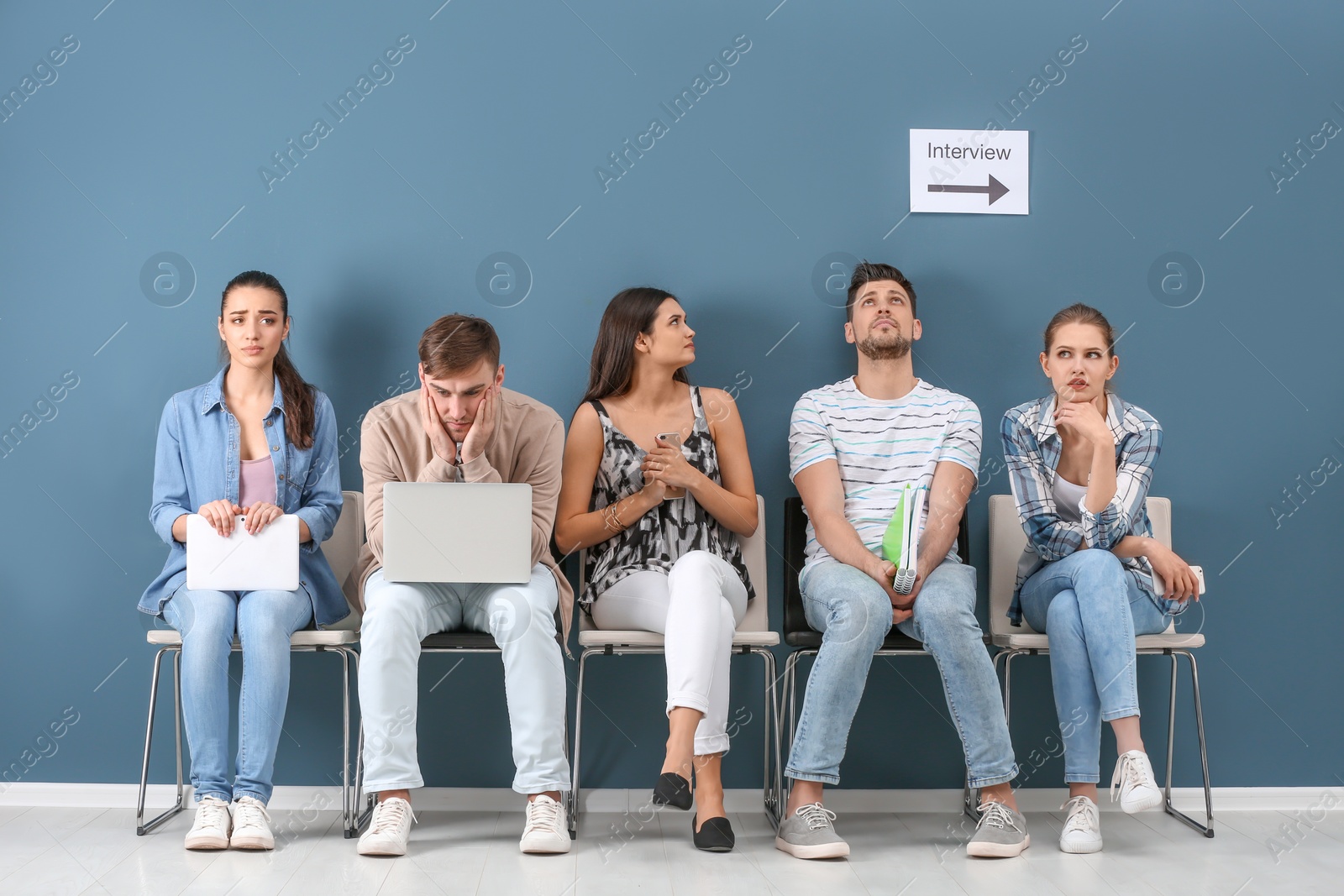 Photo of Group of people waiting for job interview, indoors