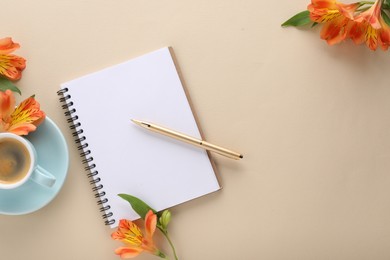 Guest list. Notebook, pen, coffee and beautiful flowers on beige table, flat lay. Space for text