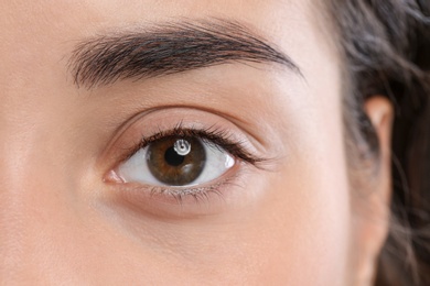 Young woman with beautiful natural eyelashes, closeup view