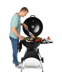 Man cooking on barbecue grill, white background