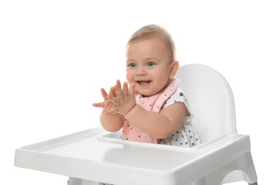 Photo of Cute little baby wearing bib in highchair on white background