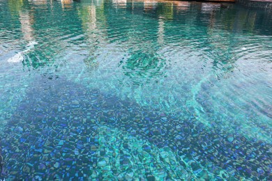 Clear rippled water in swimming pool outdoors