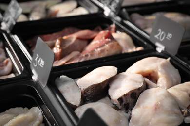 Photo of Steaks of fresh fish in supermarket, closeup