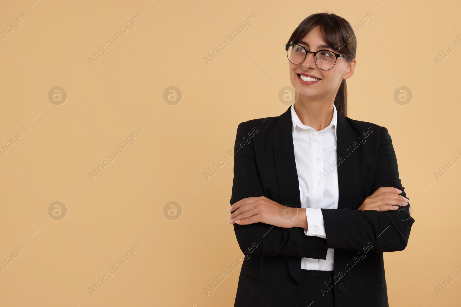 Photo of Portrait of happy secretary on beige background. Space for text