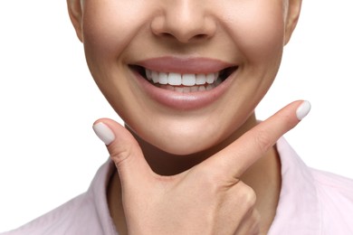 Photo of Woman showing her clean teeth and smiling on white background, closeup