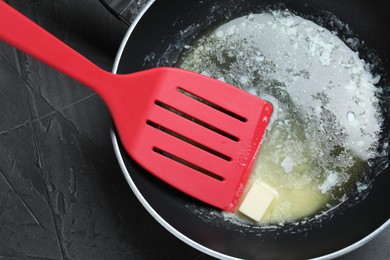 Melting butter in frying pan, top view