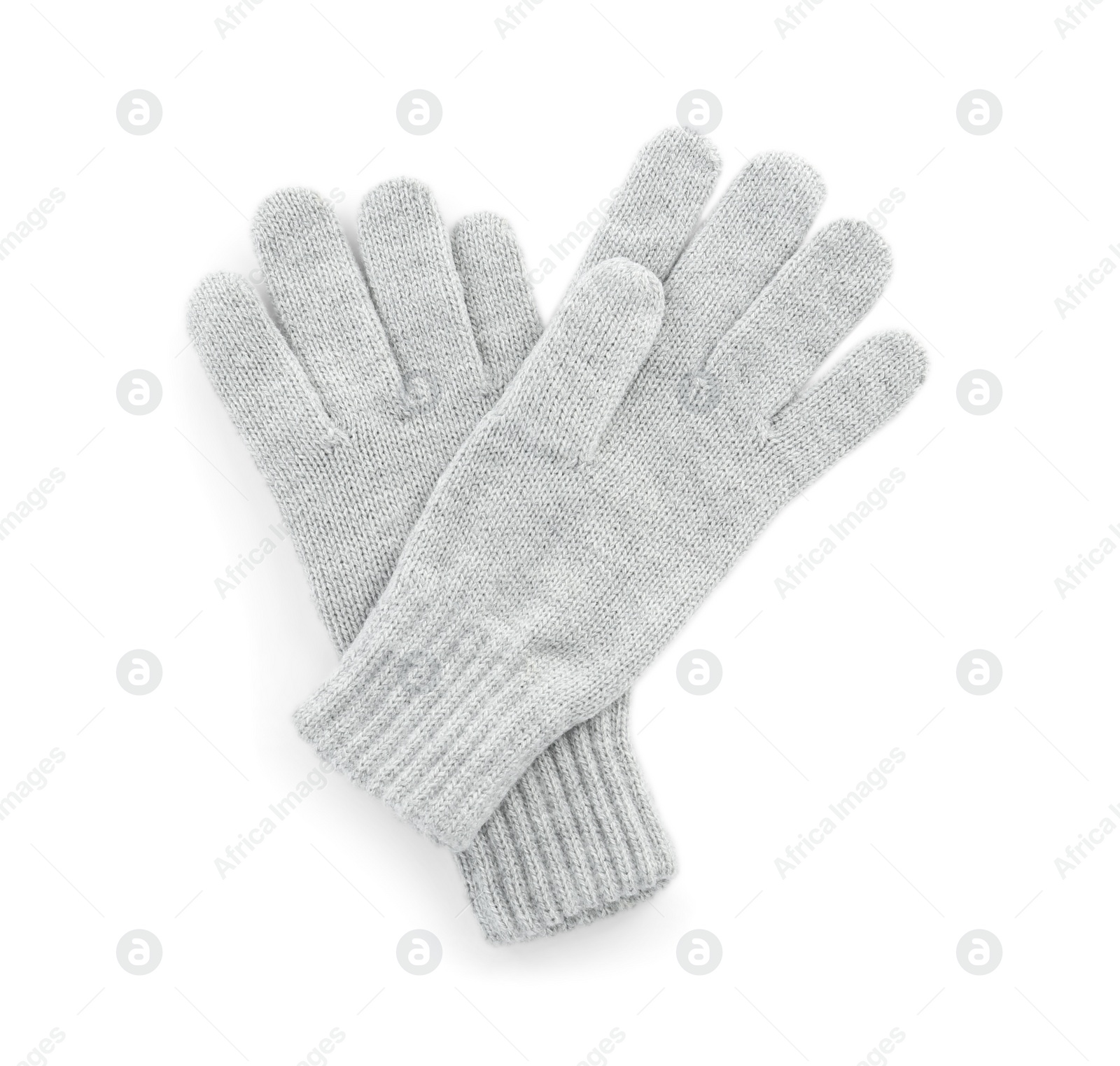 Photo of Pair of woolen gloves on white background, top view. Winter clothes