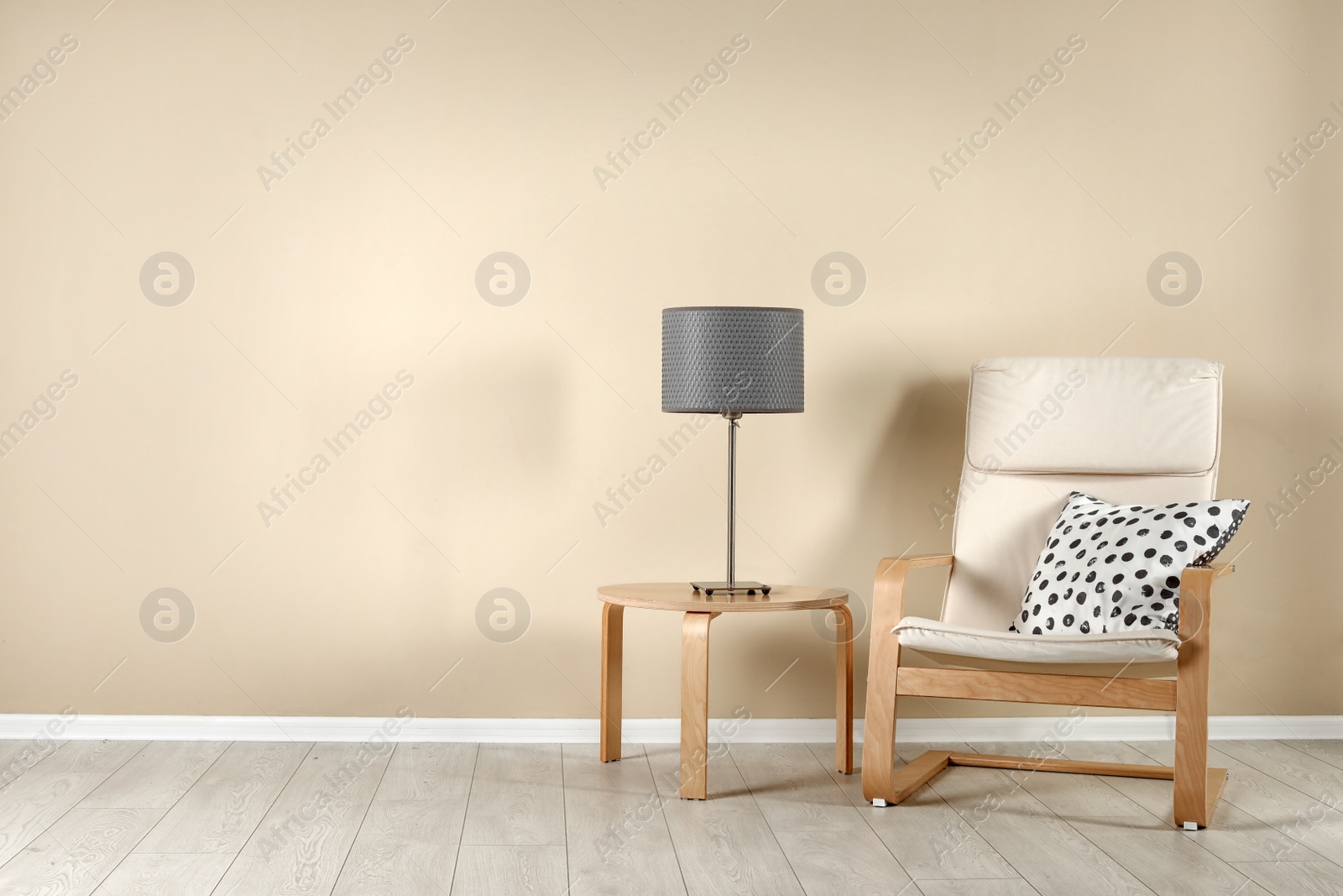 Photo of Comfortable armchair in stylish living room interior with space for text